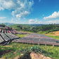 Outdoor drying racks for coffee against a scenic landscape with blue sky and clouds.
